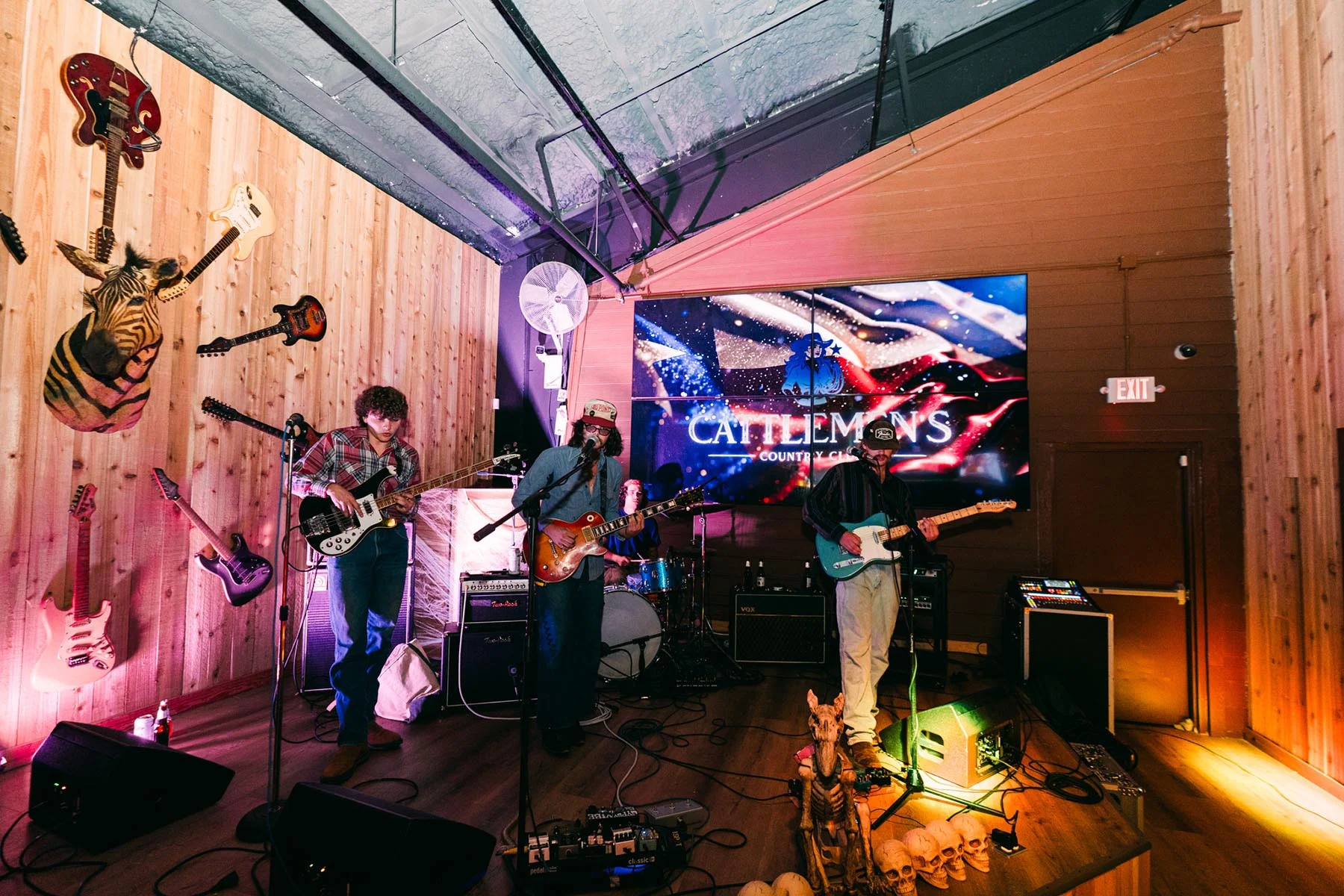 The stage and LED screen at Cattlemen's Country Club with a band setting up