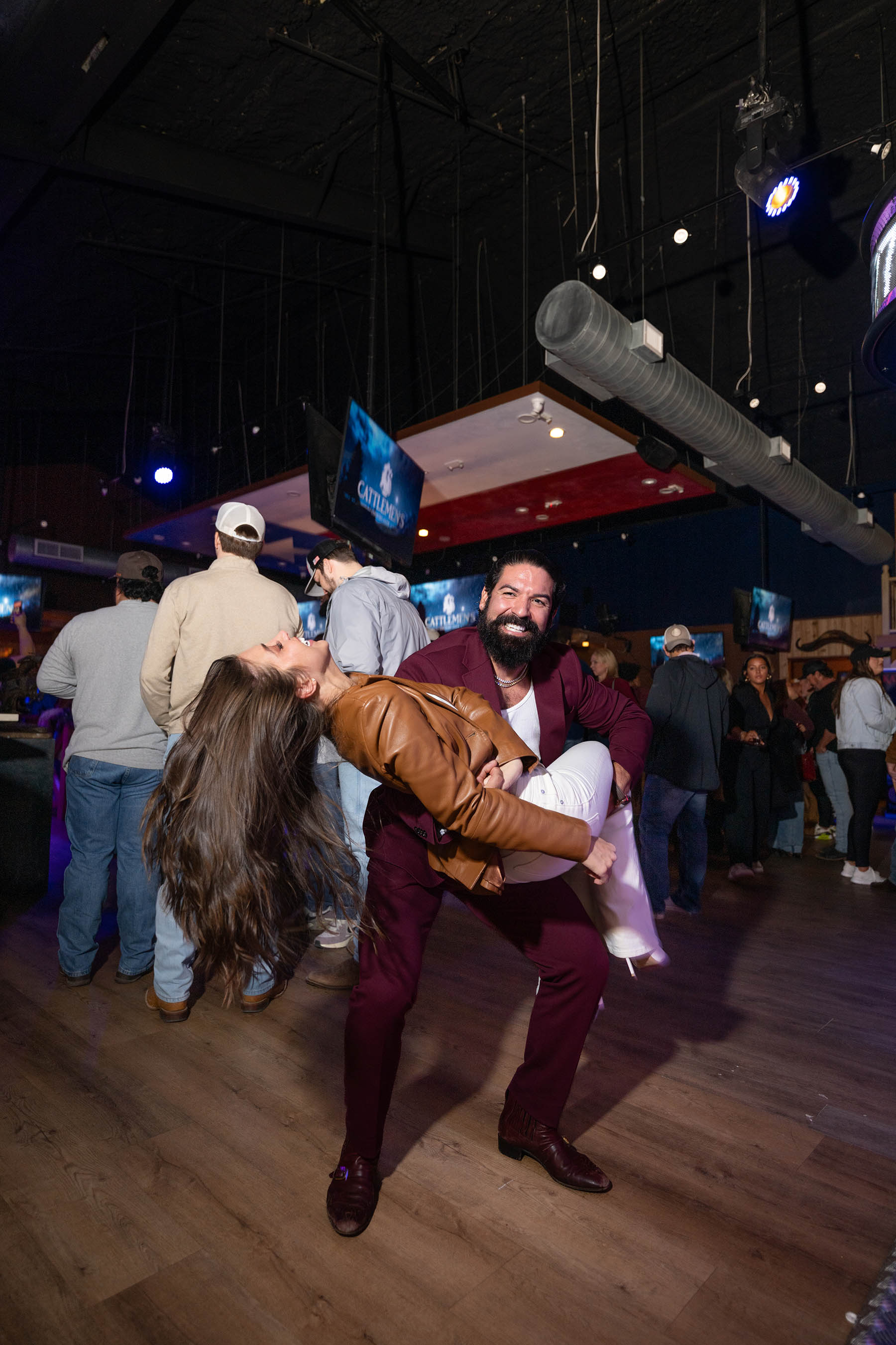 A couple mid-dip on the dance floor at Cattlemen's Country Club in Houston Heights